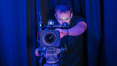 A Stream7 technician adjusts camera settings