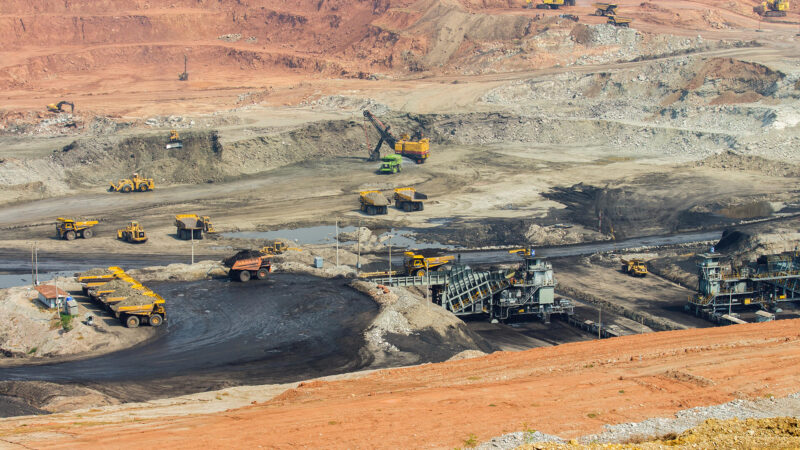 Part of a pit with big mining truck working